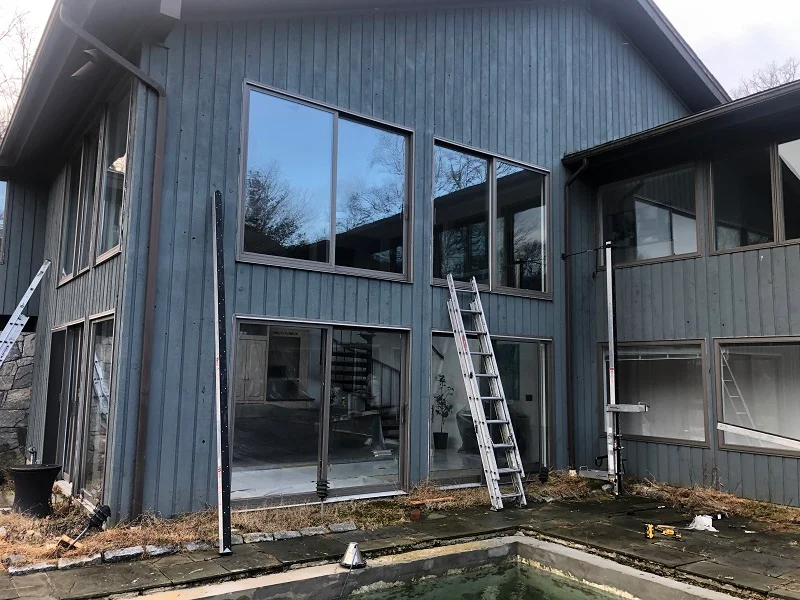 Second floor patio door will be replaced with picture windows